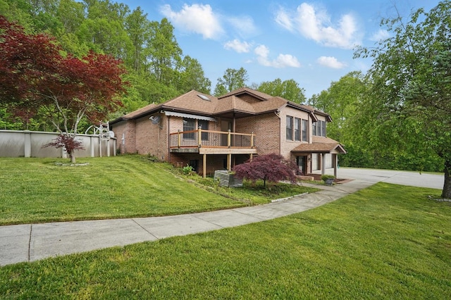 271 Burgan Rd, Pennington Gap, VA 24277 - view of front of house featuring brick siding, a front lawn, a wooden deck, and an outdoor pool