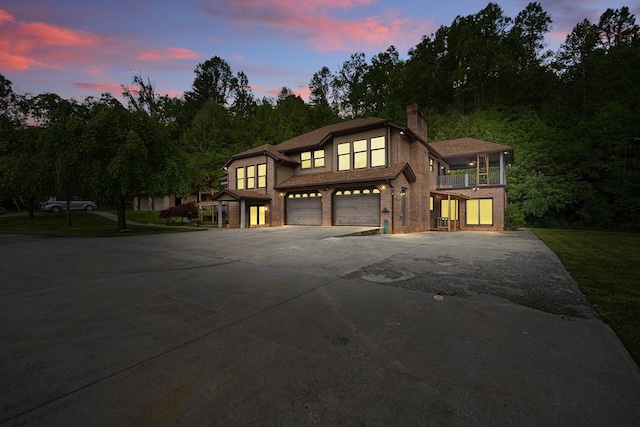 271 Burgan Rd, Pennington Gap, VA 24277 - view of front of property with a balcony, a garage, driveway, a chimney, and brick siding