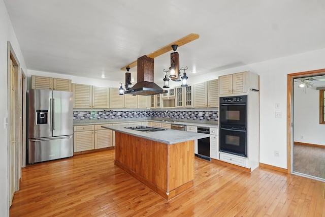 271 Burgan Rd, Pennington Gap, VA 24277 - kitchen with black appliances, wall chimney range hood, light countertops, and tasteful backsplash