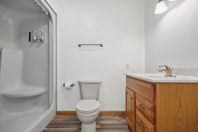 271 Burgan Rd, Pennington Gap, VA 24277 - full bath featuring vanity, a stall shower, toilet, wood finished floors, and baseboards