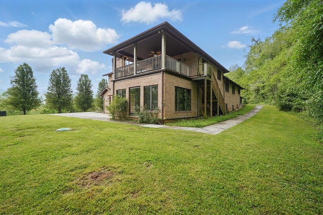 271 Burgan Rd, Pennington Gap, VA 24277 - back of house featuring ceiling fan, stairway, brick siding, a lawn, and a balcony
