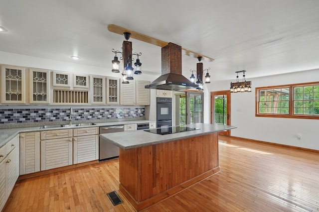 271 Burgan Rd, Pennington Gap, VA 24277 - kitchen featuring dishwasher, wall chimney range hood, a center island, backsplash, and black electric stovetop