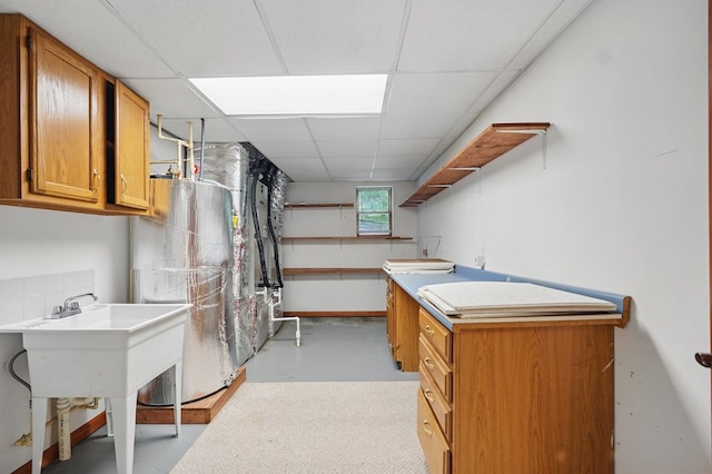 271 Burgan Rd, Pennington Gap, VA 24277 - basement with a drop ceiling, baseboards, and water heater
