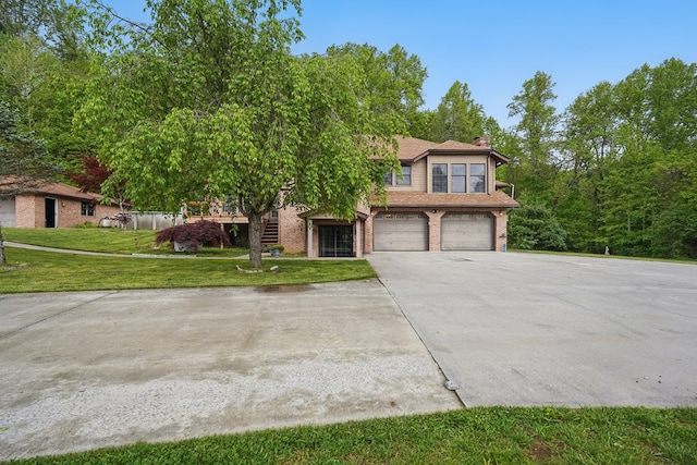271 Burgan Rd, Pennington Gap, VA 24277 - view of front of home with a garage, stairs, driveway, brick siding, and a front yard