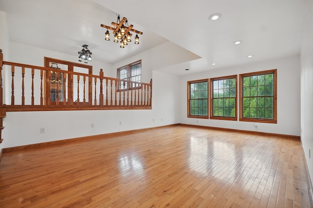 271 Burgan Rd, Pennington Gap, VA 24277 - unfurnished living room with healthy amount of natural light, hardwood / wood-style floors, recessed lighting, baseboards, and a chandelier