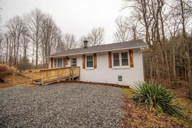 ranch-style home featuring a wooden deck