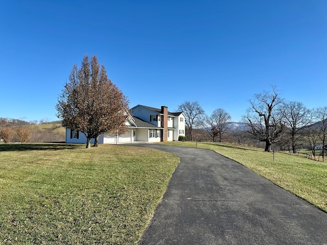 view of front of home featuring a front lawn