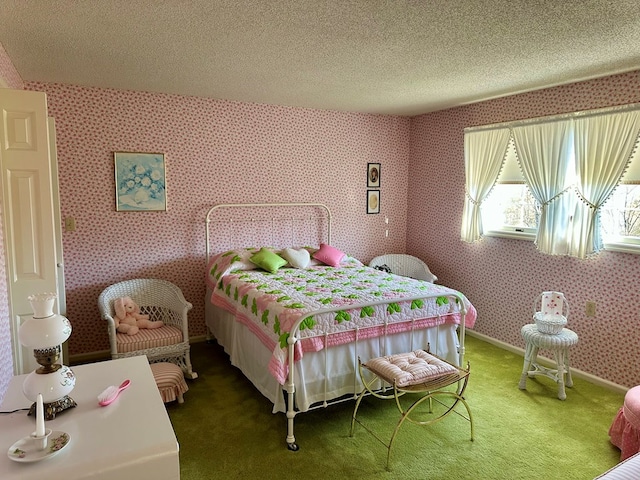 bedroom featuring carpet and a textured ceiling