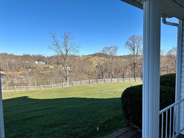 view of yard with a rural view