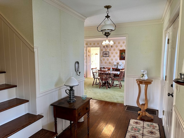 interior space with ornamental molding and dark hardwood / wood-style floors