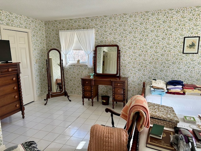 sitting room with light tile patterned floors and a textured ceiling