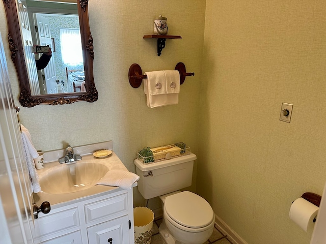 bathroom with vanity and toilet