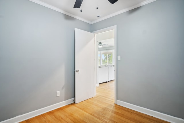 411 Courtland Cir, Galax, VA 24333 - empty room with a ceiling fan, light wood finished floors, baseboards, and crown molding