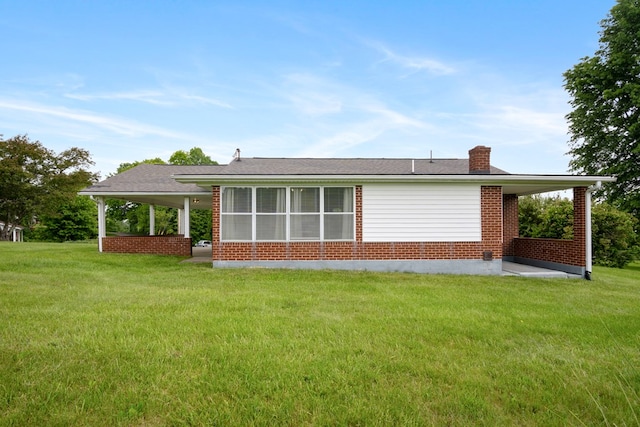 411 Courtland Cir, Galax, VA 24333 - back of property featuring brick siding, a chimney, and a yard