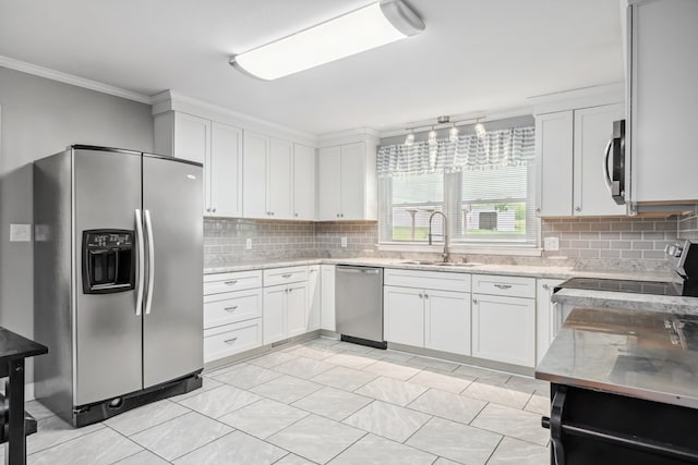 411 Courtland Cir, Galax, VA 24333 - kitchen featuring appliances with stainless steel finishes, a sink, crown molding, backsplash, and white cabinetry