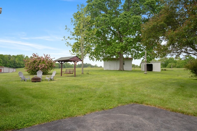 411 Courtland Cir, Galax, VA 24333 - view of grassy yard featuring a gazebo and a fire pit