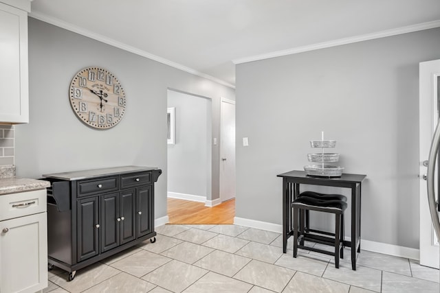 411 Courtland Cir, Galax, VA 24333 - kitchen with ornamental molding, white cabinets, light tile patterned floors, and baseboards