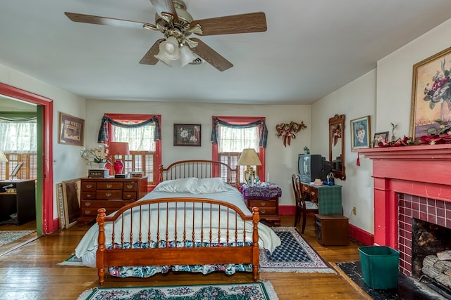 210 Valley St NE, Abingdon, VA 24210 - bedroom featuring wood-type flooring, a tile fireplace, and a ceiling fan