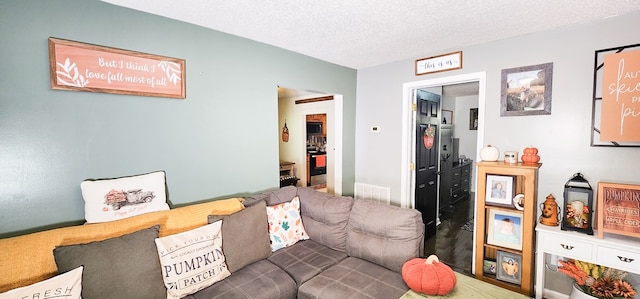 living room with a textured ceiling