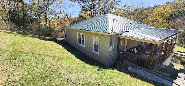 view of property exterior featuring a lawn