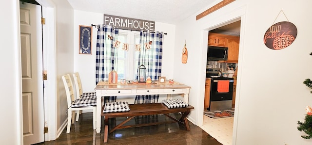 dining area with a textured ceiling