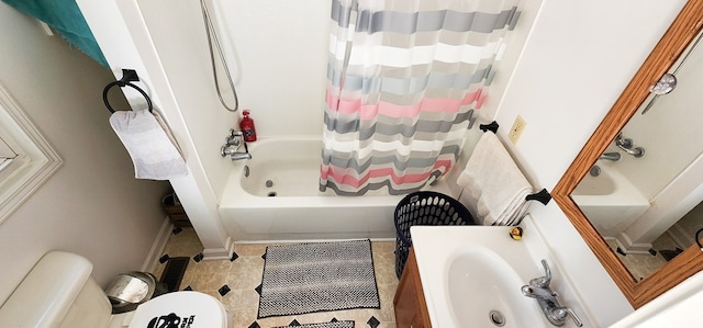 full bathroom featuring shower / bath combination with curtain, tile patterned floors, toilet, and sink