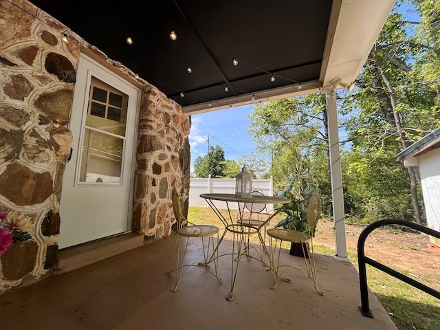 view of patio / terrace featuring fence