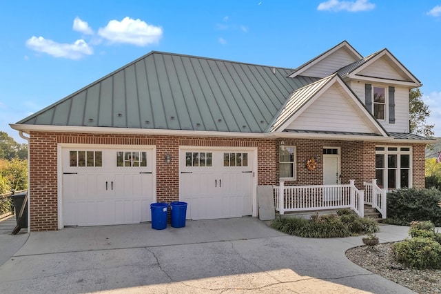 view of front of house with a porch and a garage