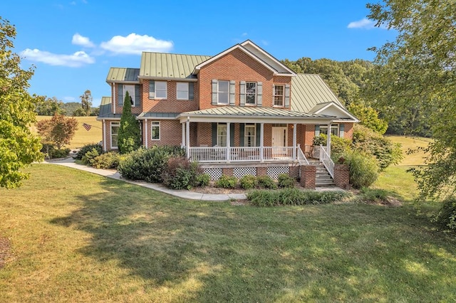 view of front of house with a porch and a front yard