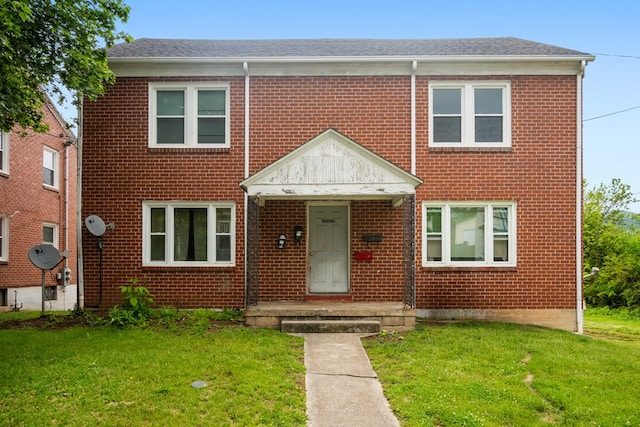 222 Randolph Ave, Pulaski, VA 24301 - multi unit property with brick siding, a front lawn, and a shingled roof