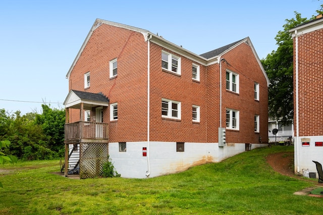 222 Randolph Ave, Pulaski, VA 24301 - view of property exterior featuring stairs, brick siding, a lawn, and a deck
