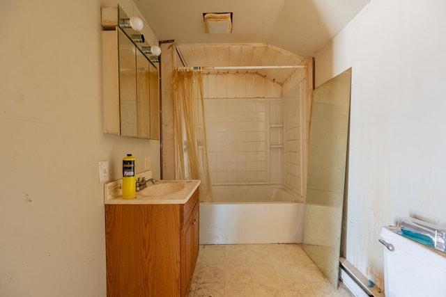 bathroom featuring vaulted ceiling, shower / bathtub combination with curtain, and vanity