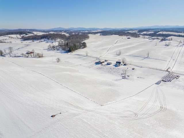 drone / aerial view featuring a mountain view