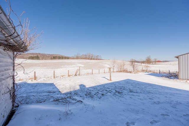 view of yard layered in snow