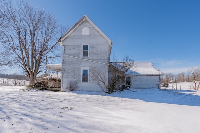 view of snow covered house