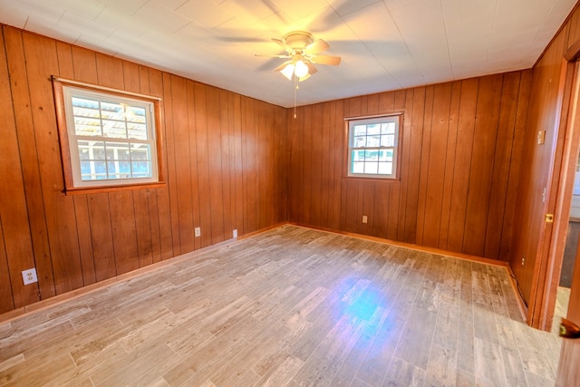 spare room with light hardwood / wood-style floors and ceiling fan