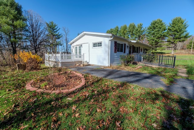 view of home's exterior with a deck