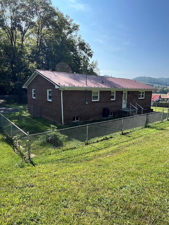 128 Roberts Chapel Rd, Saltville, VA 24370 - view of side of property with brick siding and metal roof