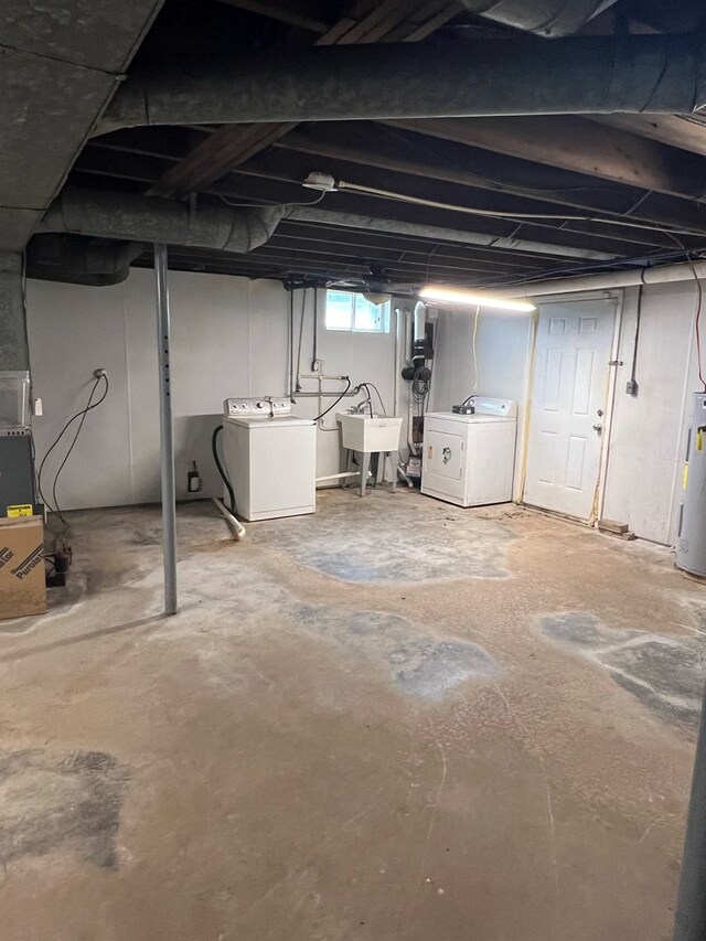 128 Roberts Chapel Rd, Saltville, VA 24370 - basement with separate washer and dryer, a sink, and water heater