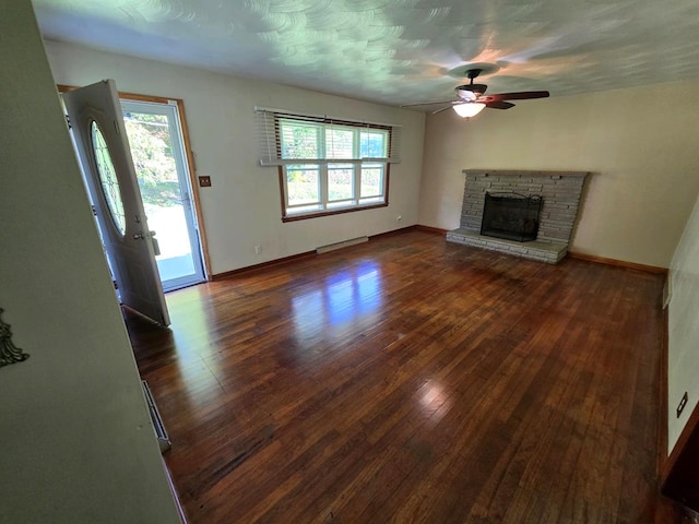 128 Roberts Chapel Rd, Saltville, VA 24370 - unfurnished living room with healthy amount of natural light, ceiling fan, hardwood / wood-style floors, and a fireplace
