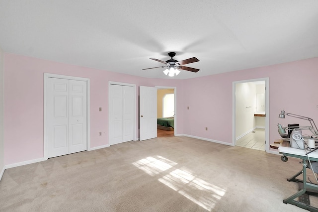 18959 Middle Dr, Abingdon, VA 24211 - unfurnished bedroom with two closets, carpet flooring, ensuite bathroom, and ceiling fan