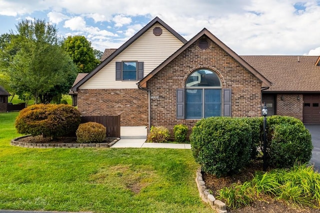 18959 Middle Dr, Abingdon, VA 24211 - view of front facade featuring brick siding, a front yard, and a shingled roof