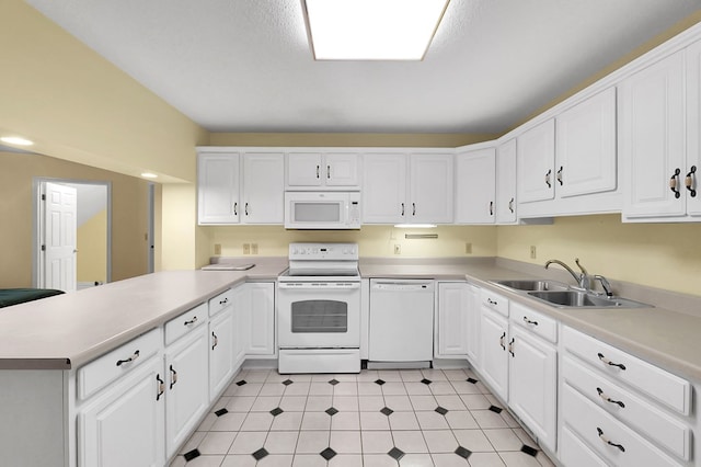 18959 Middle Dr, Abingdon, VA 24211 - kitchen with white appliances, a peninsula, light countertops, and white cabinets