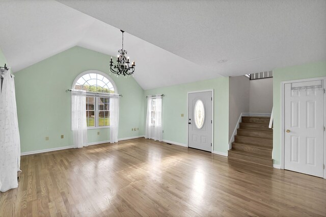 18959 Middle Dr, Abingdon, VA 24211 - entrance foyer with stairs, a chandelier, vaulted ceiling, and wood finished floors