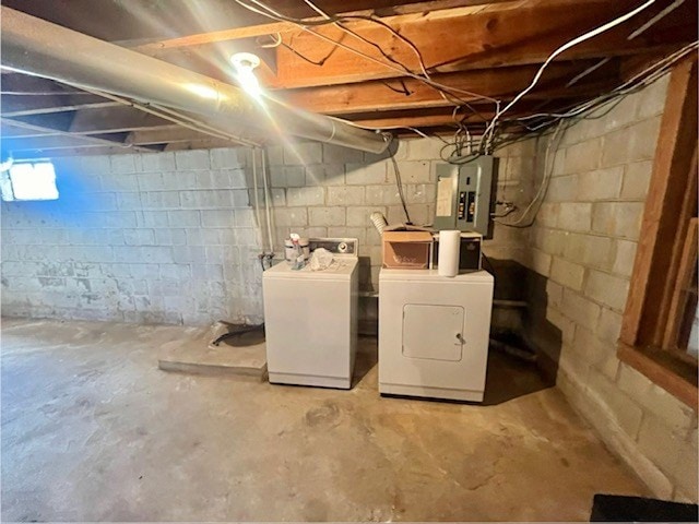 basement with separate washer and dryer and electric panel