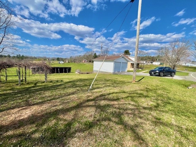 view of yard with a rural view