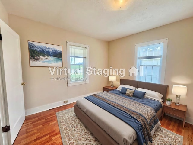 bedroom featuring wood-type flooring