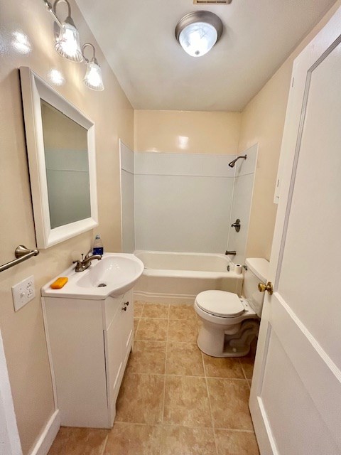 full bathroom with shower / tub combination, vanity, and toilet