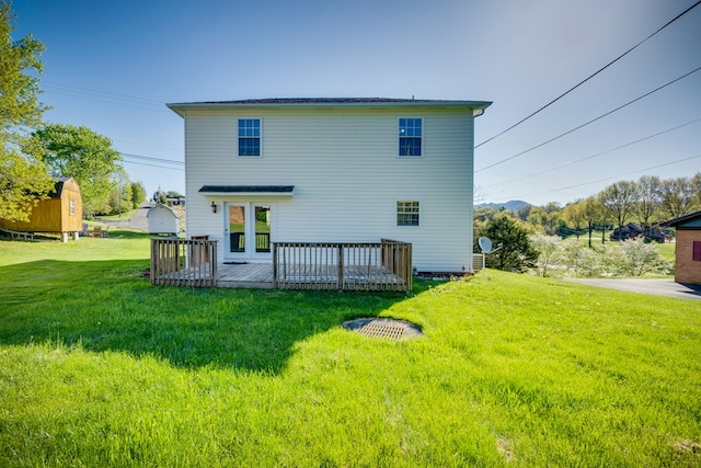467 Thru Dr, Pounding Mill, VA 24637 - back of house with a wooden deck, a lawn, and a storage unit