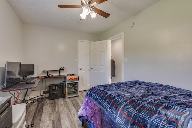 467 Thru Dr, Pounding Mill, VA 24637 - bedroom featuring wood finished floors, a desk, and ceiling fan